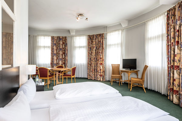 Driepersoonskamers en appartementen